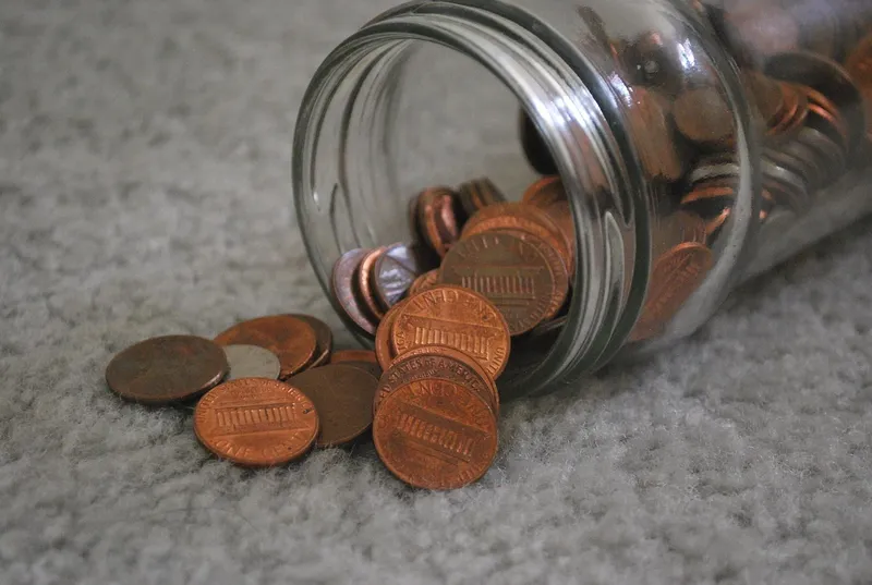 Coins in glass jar